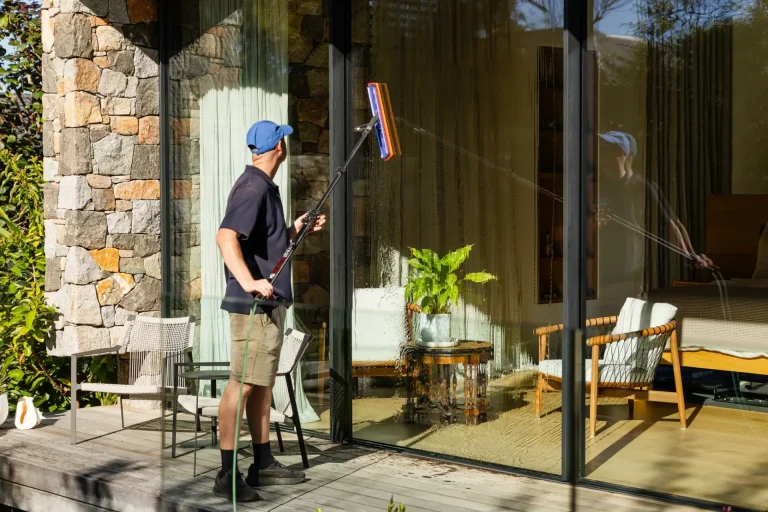 Cleaning patio glass doors with an extended squeegee in Perth