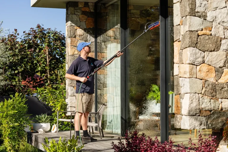 Cleaning stone-house windows with a water-fed pole in Nedlands, Perth