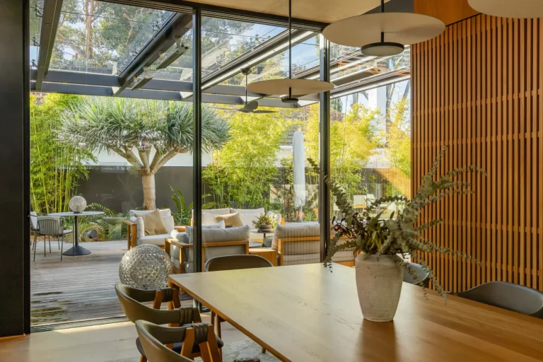 Dining area with clear glass doors onto the patio after a window clean