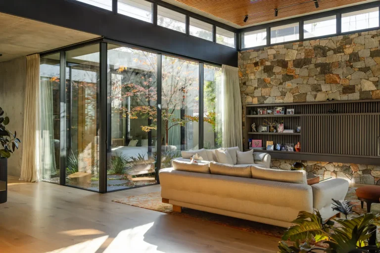 Spotless floor-to-ceiling windows in a modern Perth living room