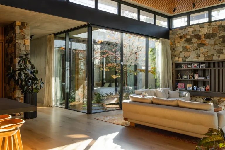 Crystal-clear windows framing a courtyard garden at a Nedlands home in Perth