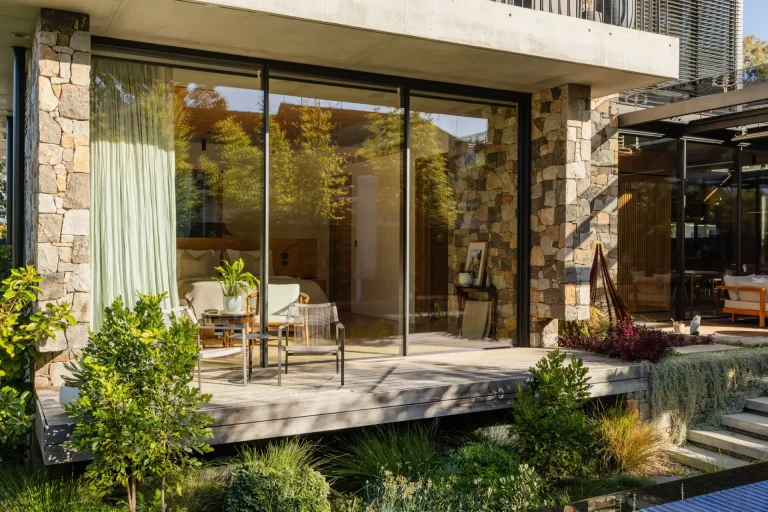 Clean sliding glass doors of a stone-walled house in Nedlands, Perth