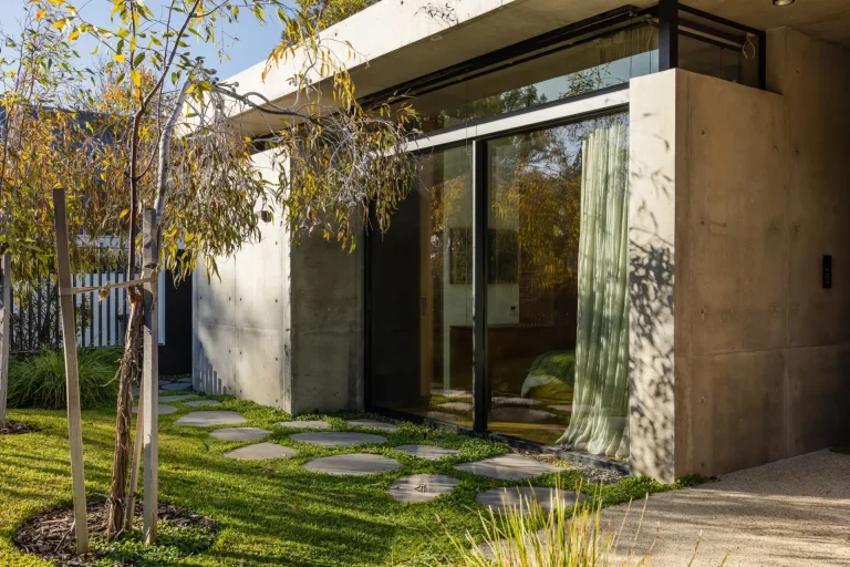 Modern Perth home with clean glass sliding doors and landscaped yard