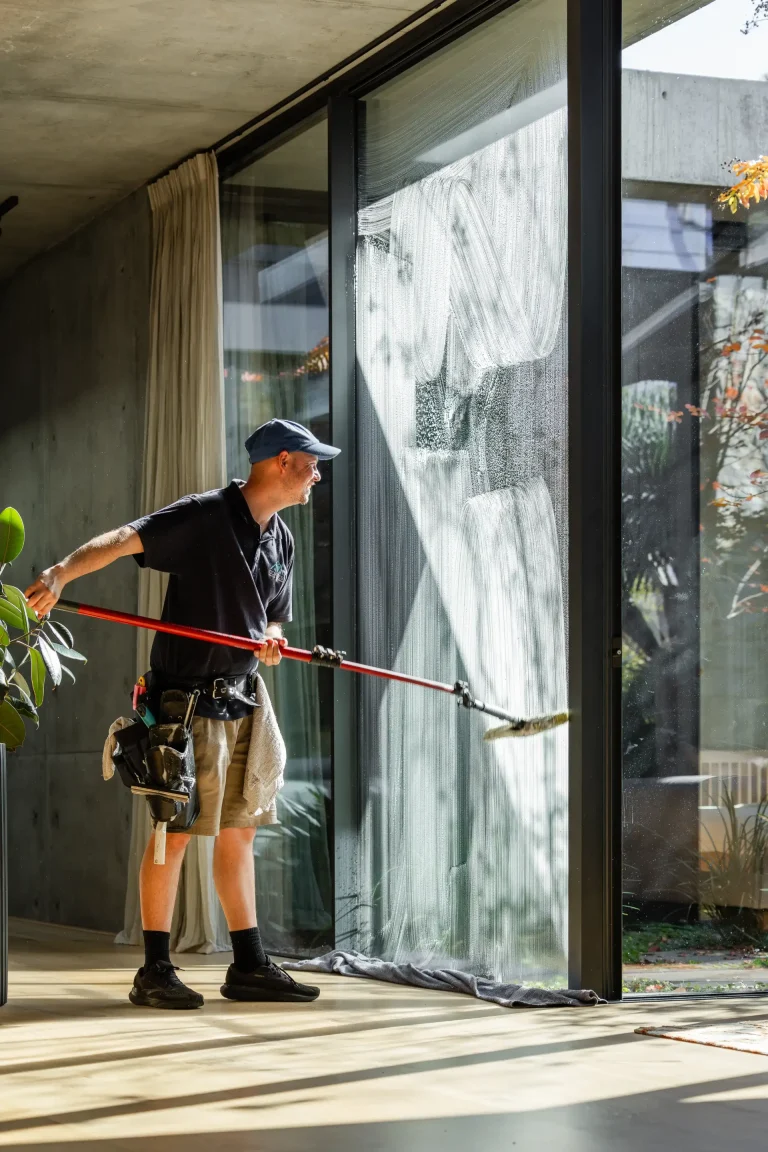Interior window cleaning with sunlight streaming through at a Perth home